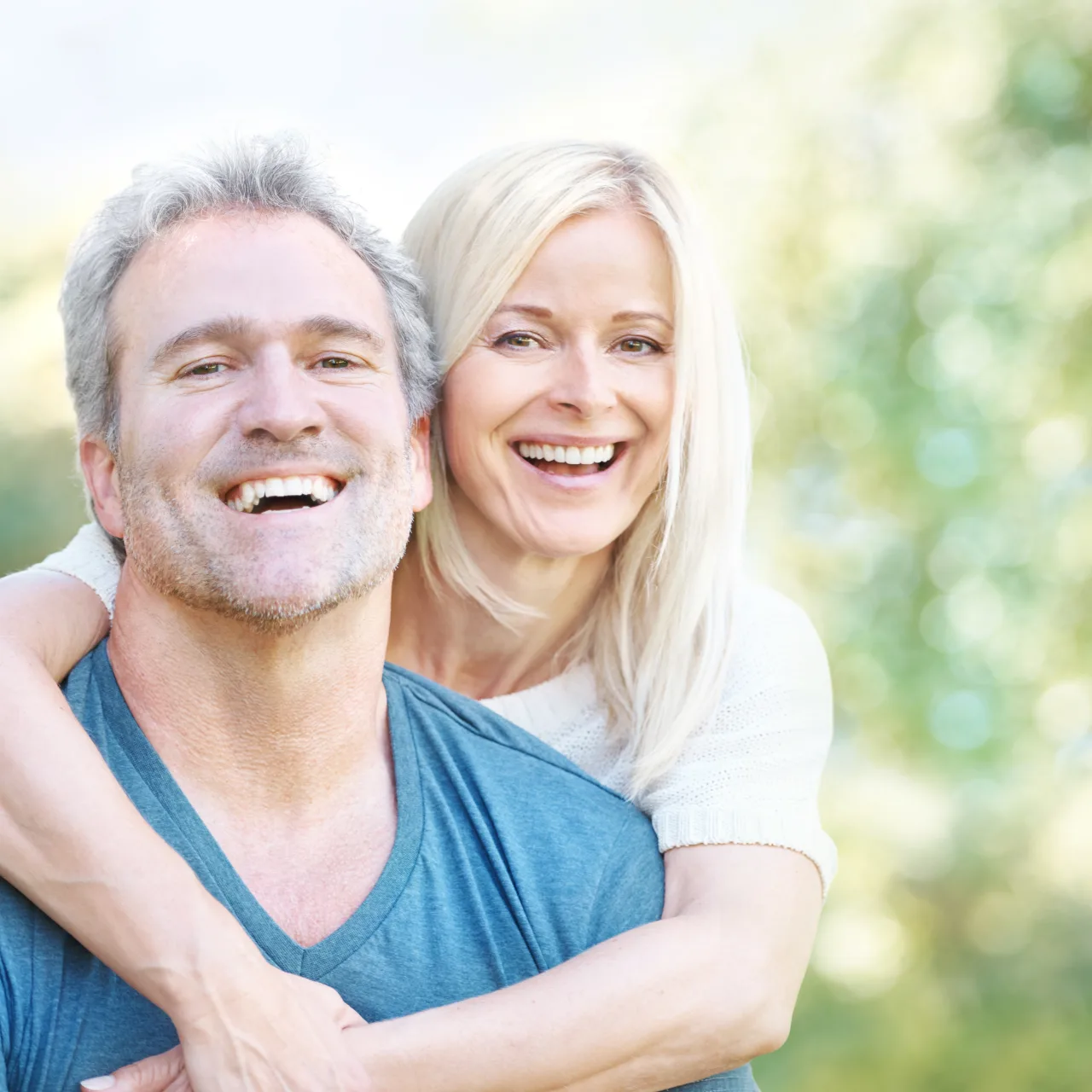 Mature couple smiling outdoors
